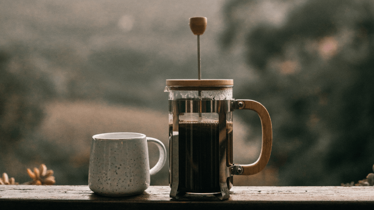 French press in rustic setting